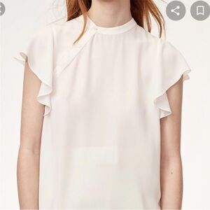 34. Babaton blouse white shoulder button detail
